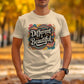 Man wearing a cream-colored t-shirt with a vibrant retro design that reads &quot;Different is Beautiful&quot; in bold, white stylized lettering. The colorful 70s-inspired graphic features heart and swirl patterns in teal, mustard, pink, and orange. The shirt has a classic fit and short sleeves, perfect for spreading a positive, inclusive message with a vintage twist. Autumn leaves and trees in the background.